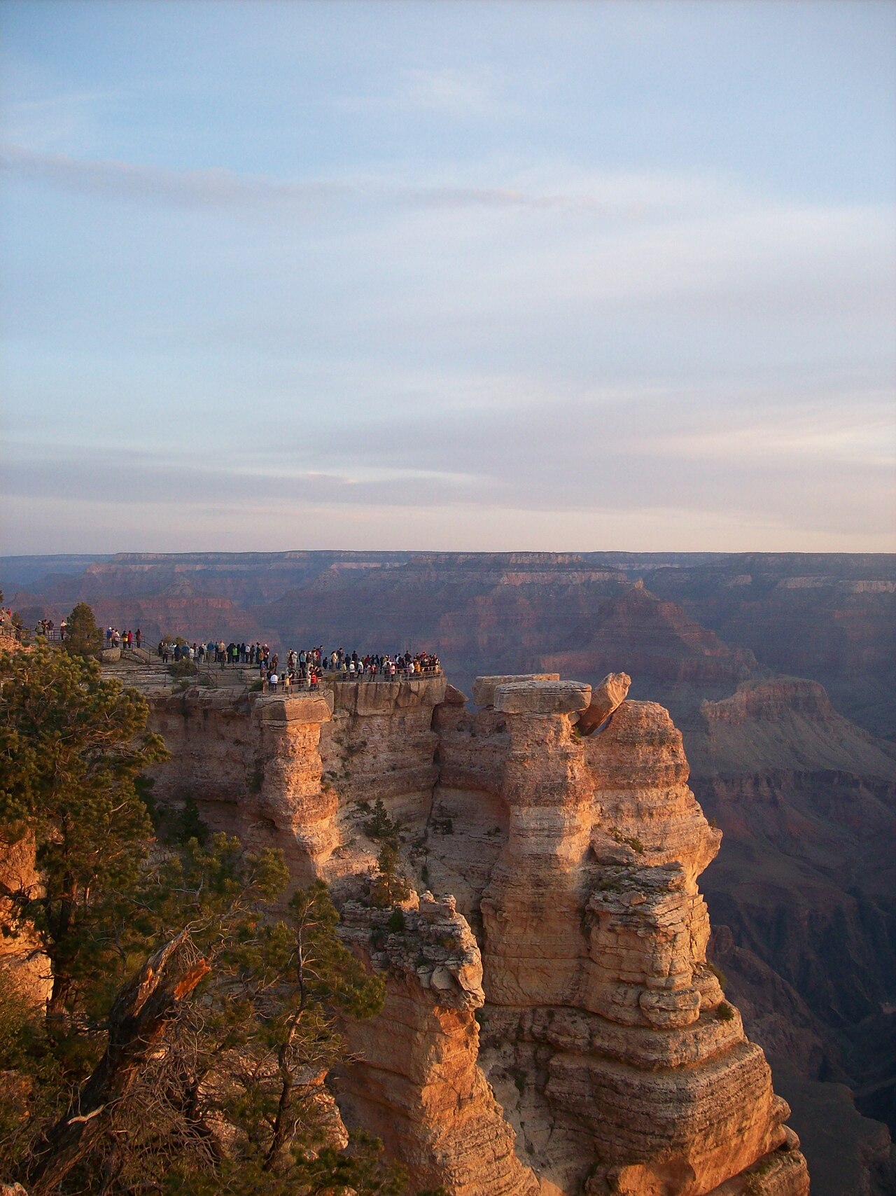Layered red and gold cliffs of the Grand Canyon at sunrise, seen from Mather Point